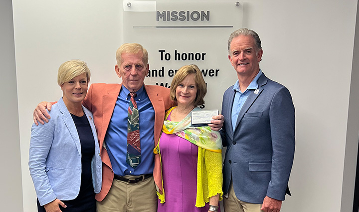 WWP supporters Mike and Maureen Swartz pose for a picture with WWP CEO Walt Piatt and WWP teammate Megan Pusateri.