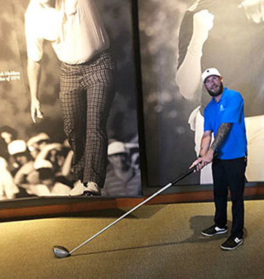 Warrior Matt Glisson works on his golf swing.