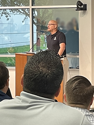Dan Miller speaking at an event