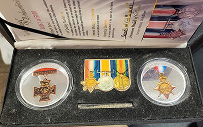 Two challenge coins in a display box