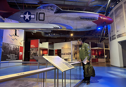 Air Force Capt. Tyshawn Jenkins visiting the Tuskegee Airmen National Historical Museum.