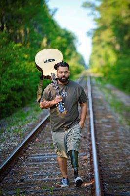 Sal enjoys his guitar.