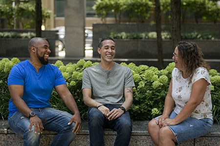 Three WWP warriors laugh together.