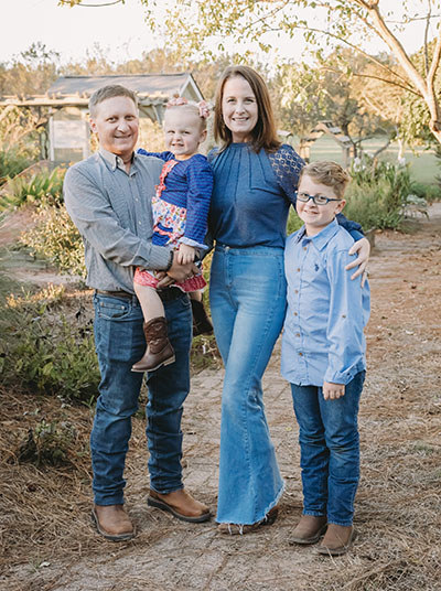 Marine veteran Reese Howell with his wife and two children.