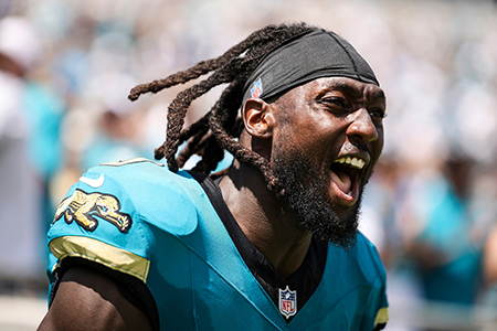 Jacksonville Jaguars linebacker Devin Lloyd takes the field. Off the field, Devin spends time supporting military kids at his football camps.
