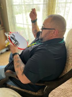 David doing the WWP logo in cross-stitch