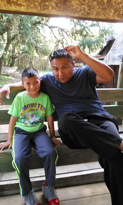 Marine veteran John Casares with son at a WWP event at a ranch.