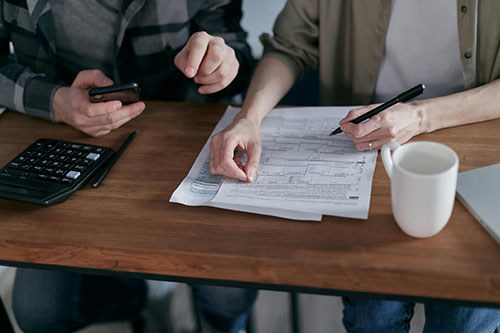 A couple looks over their budget.