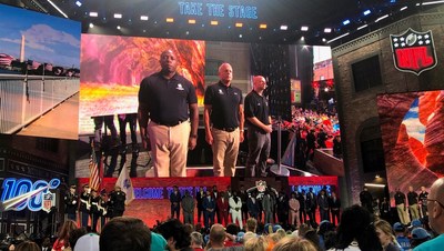 Three warriors stand on stage during the national anthem at the 2019 NFL Draft in Nashville, Tennessee. Three warriors stand on stage during the national anthem at the 2019 NFL Draft in Nashville, Tennessee.