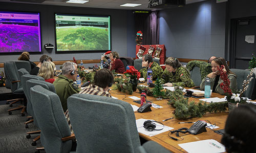 Volunteers answer phones for NORAD's Santa tracker