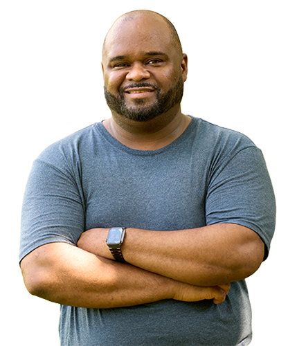 Warrior Chris Gordon smiles with his arms crossed while wearing a gray shirt and a smart watch on his left wrist.
