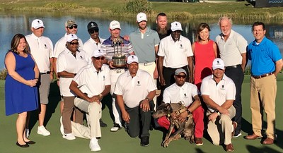 Fourteen Wounded Warrior Project® (WWP) warriors and their guests, attended the QBE Shootout at Tiburon Golf Club in Naples, Florida recently. Kevin Tway and Rory Sabbatini (center, with trophy) won the tournament. Fourteen Wounded Warrior Project® (WWP) warriors and their guests, attended the QBE Shootout at Tiburon Golf Club in Naples, Florida recently. Kevin Tway and Rory Sabbatini (center, with trophy) won the tournament.