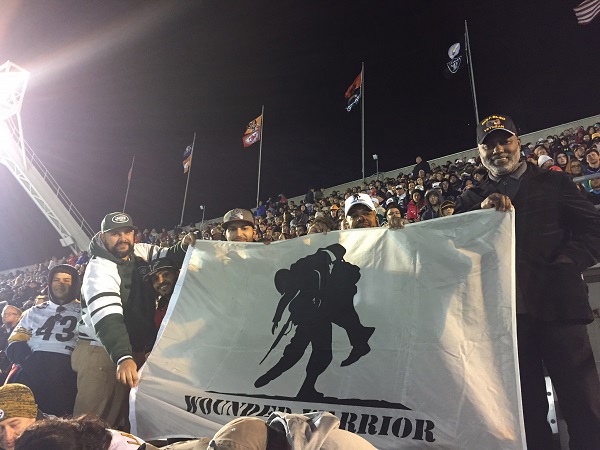 WWP warriors represent the organization with their flag at the 2017 Pro Bowl.