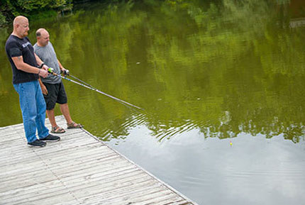 Nick and Dan fishing off dock.