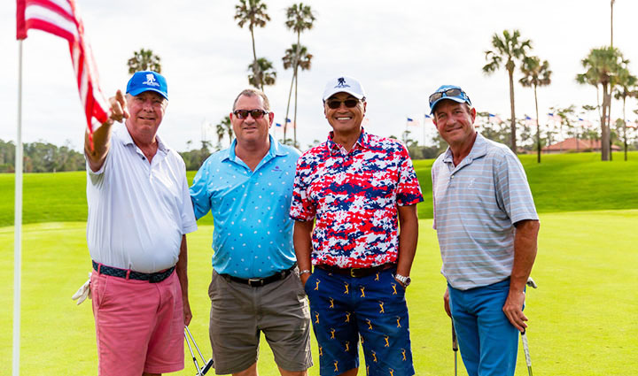 Participants at a charity golf tournament