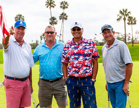 Participants at a charity golf tournament