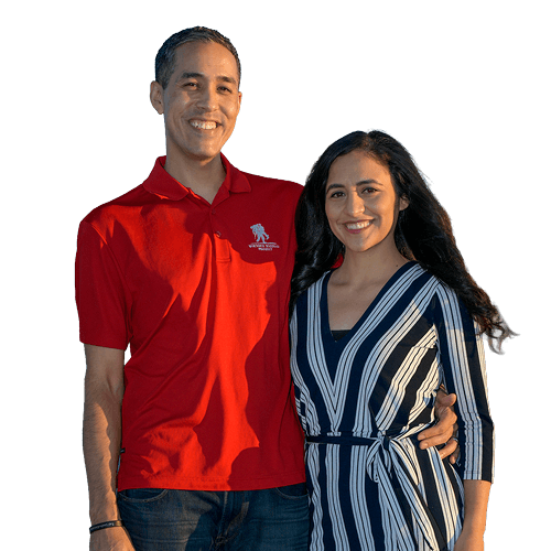 Warrior Sergio Alfaro, and his wife, Christina, smile while standing together.