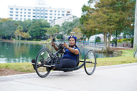 Navy veteran Sharona Young rides an adapted bicycle at Soldier Ride.