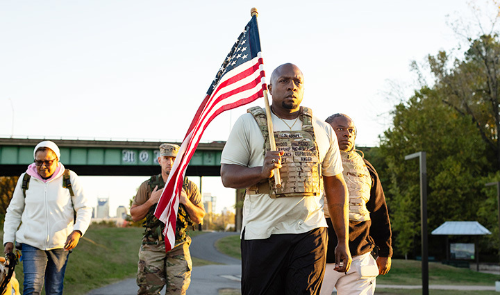 Melvin Gatewood, a Wounded Warrior Project Warrior, leading a weighted backpack walk with fellow veterans.