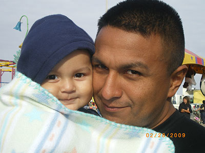 Marine veteran John Casares with young son.