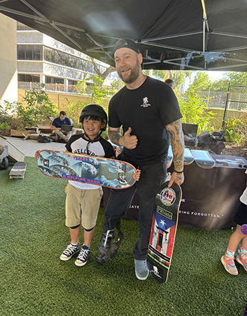 Harley Meagley talks to military kids at a skateboarding event in Jacksonville, Florida.