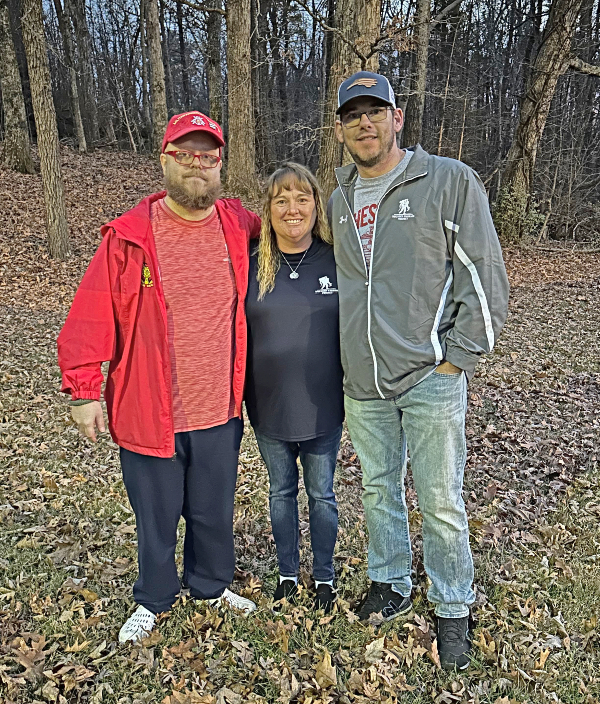 Image of Rob Caudill, Dana Hutson, and David Long at an in-person peer support group meeting in North Carolina. David now joins the group remotely from Kuwait.