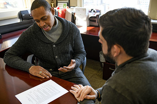 A veteran talking to a WWP staff member about their resume.